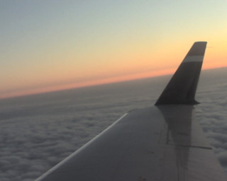 Sunset over the plane wing